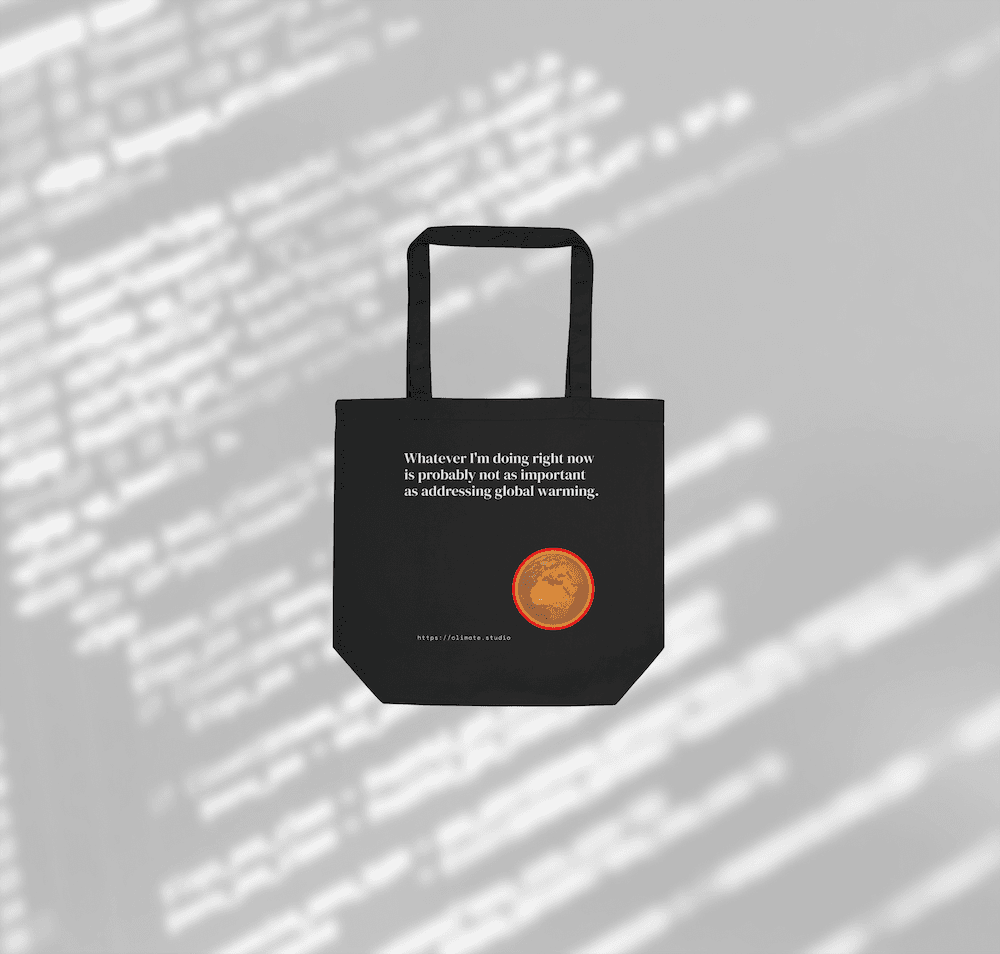 Black tote bag with climate message against code background