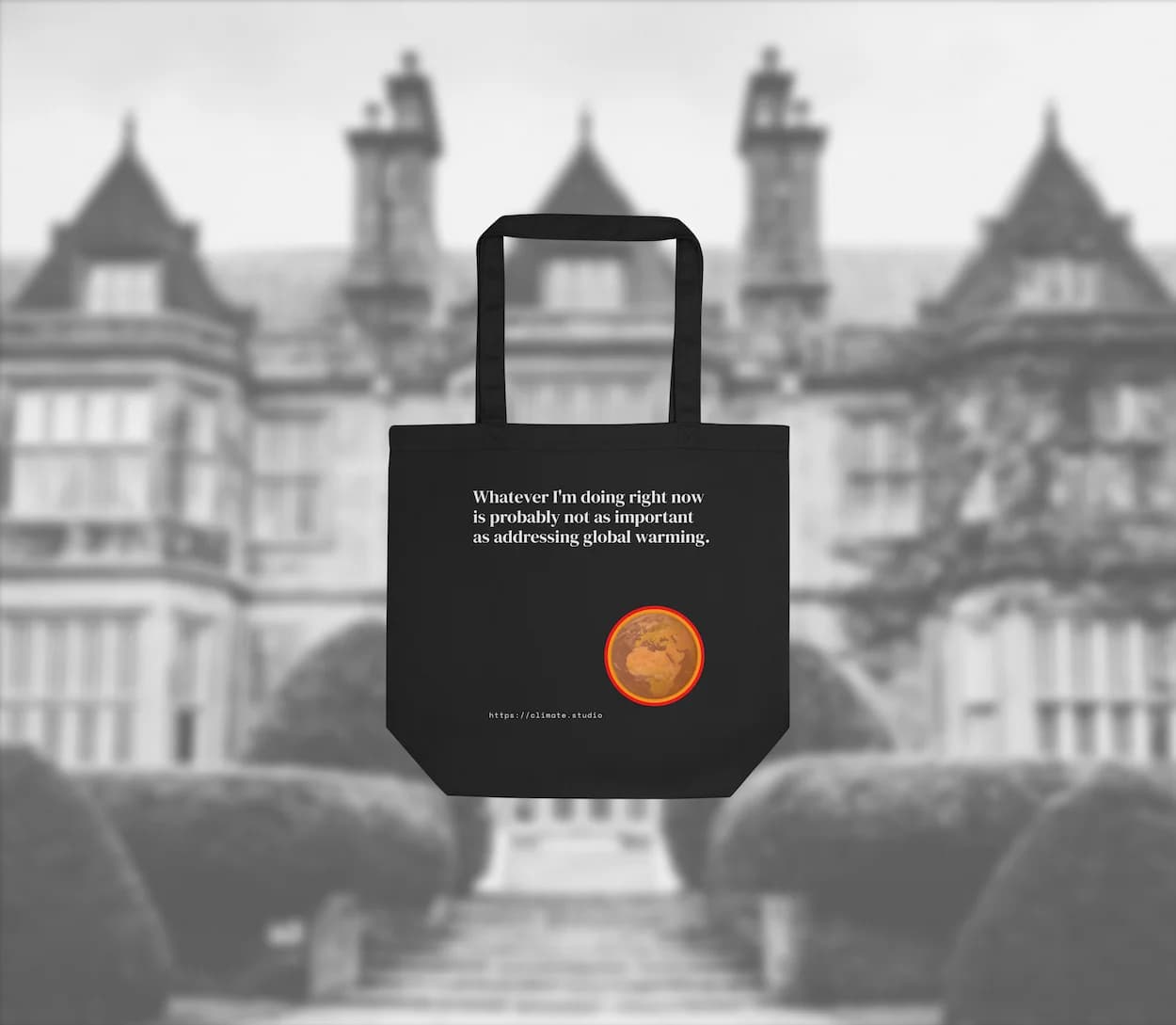 Black tote bag with climate message against home background