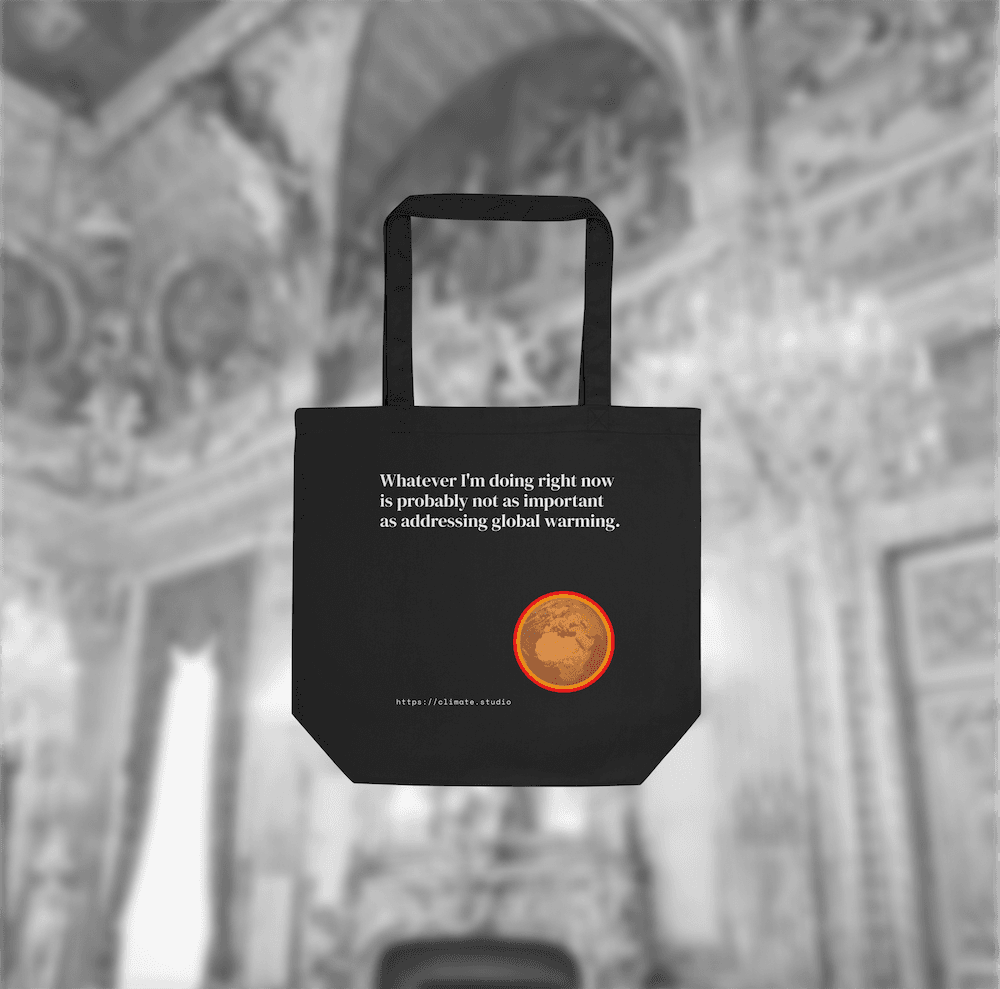 Black tote bag with climate message against luxury architecture background