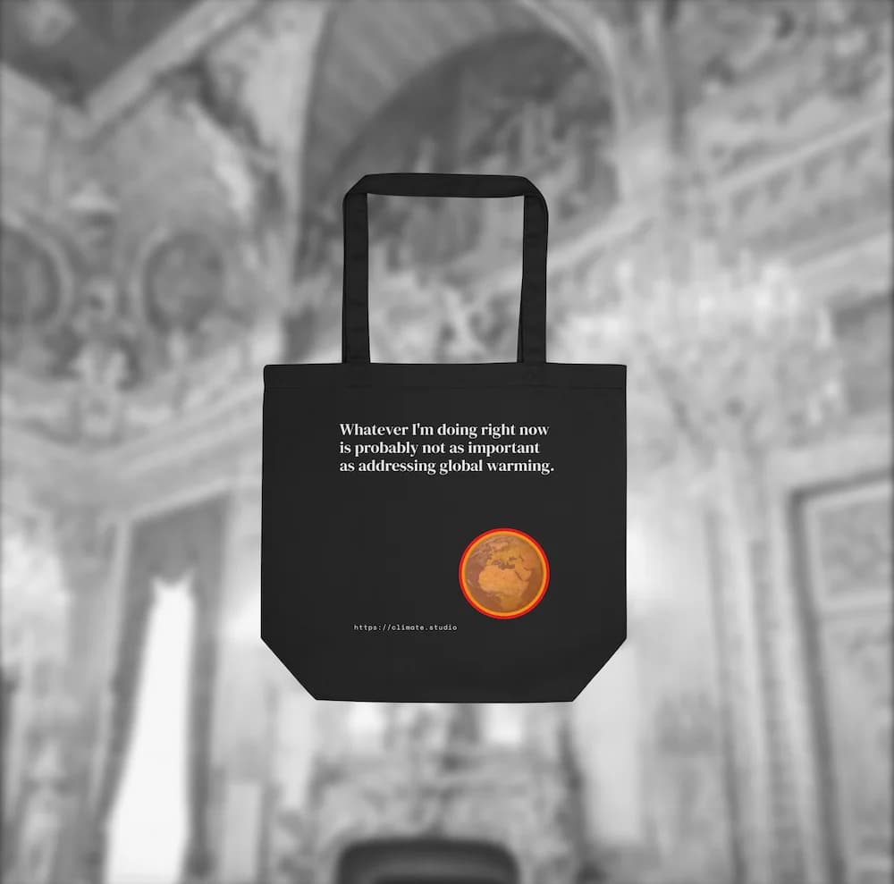 Black tote bag with climate message against luxury architecture background