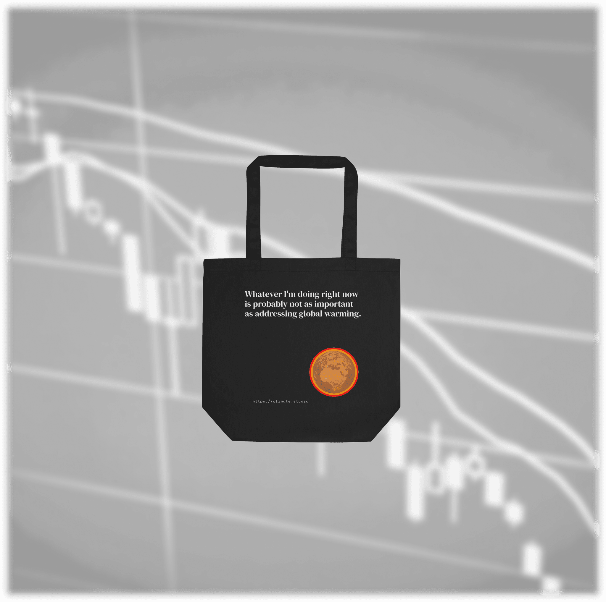 Black tote bag with climate message against financial markets background