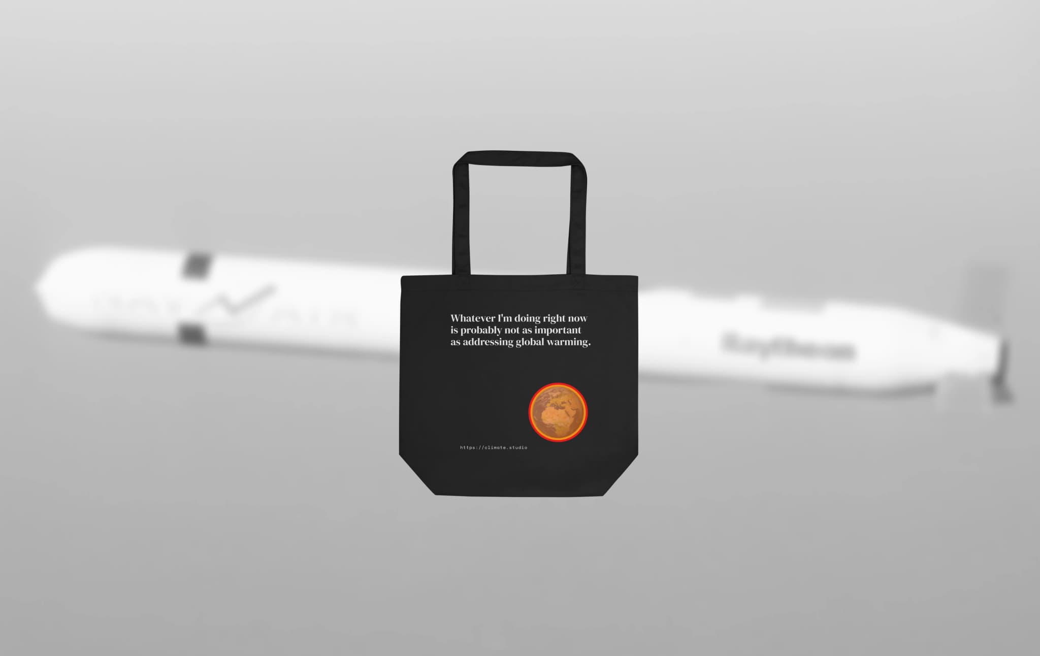 Climate Studio tote bag with global warming message against missile launch background