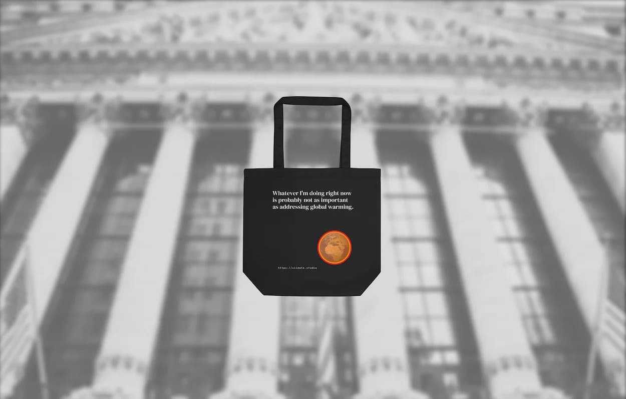 Black tote bag with climate message against Wall Street background