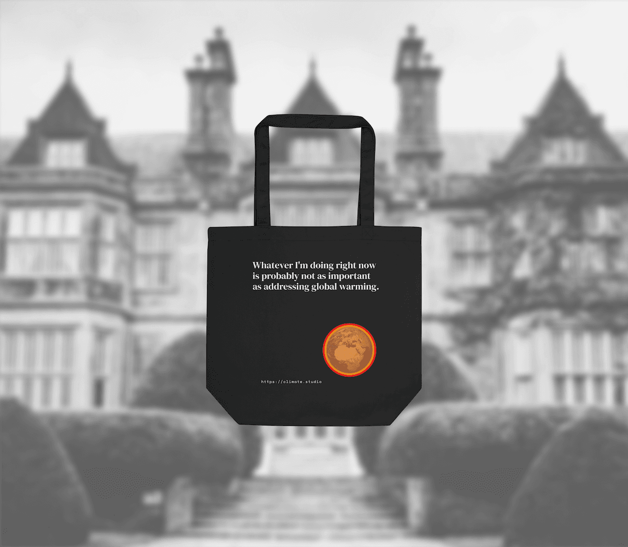 Black tote bag with climate message against home background